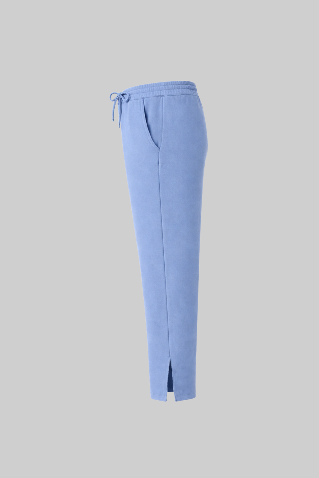 Light blue sweatpants with drawstring o on a gray background
